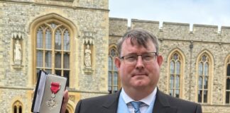 Volunteer receives MBE from Prince William in recognition of charity work Hywel Peterson MBE Windsor