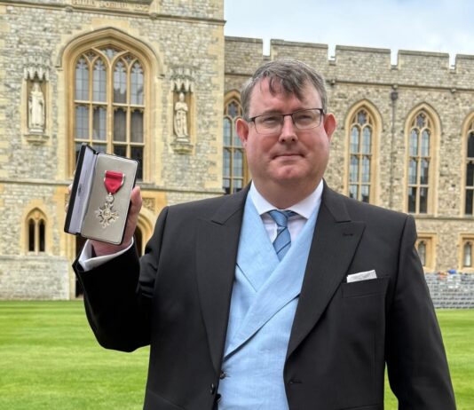 Volunteer receives MBE from Prince William in recognition of charity work Hywel Peterson MBE Windsor