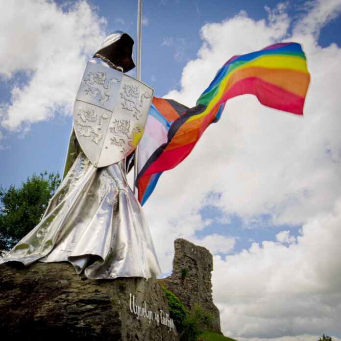 Statue and Progress flag COURTESY OF Jason Elberts