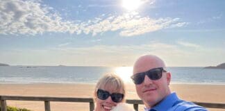 Survivor Who Thought She Was ‘Cancer Proof’ Supports Stripe A Pose 2025 Rachel with husband Dean and her dog Sheldon