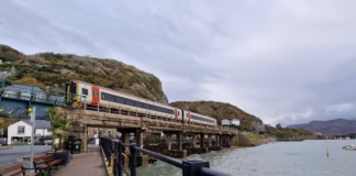 Cambrian Railway Partnership awards nearly £7,000 to community projects TfW train entering Barmouth