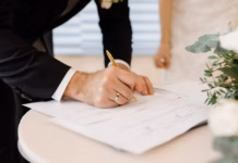 54% Of Adults Unaware Marriage Cancels Existing Wills couple love is signing official marriage documents Image by freepic cropped cropped