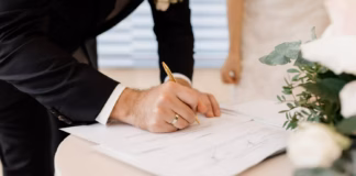 54% Of Adults Unaware Marriage Cancels Existing Wills couple love is signing official marriage documents Image by freepic cropped cropped