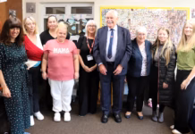 paxton with staff and family members