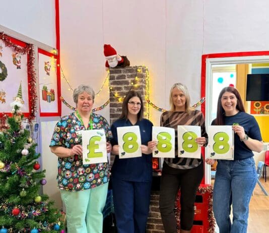 Dawns elusennol yn codi dros £8k i ward blant Bronglais Angharad Ward staff celebrate their fundraising