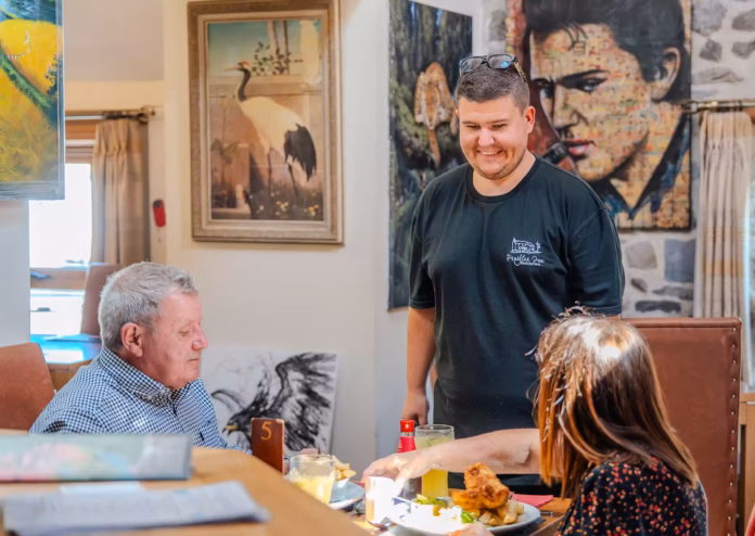 Aaron Jones with customers