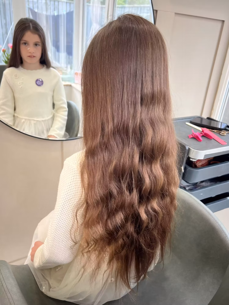 Eight-year-old Emilie-Rose raises £1,000 and donates hair to Little Princess Trust Emile Rose with long hair