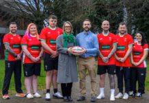 Specsavers calls on children to design Wales Deaf Rugby World Cup shirts Specsavers audiologist Kyle James centre right with Wales Deaf Rugby chair Siân Elin Melbourne c