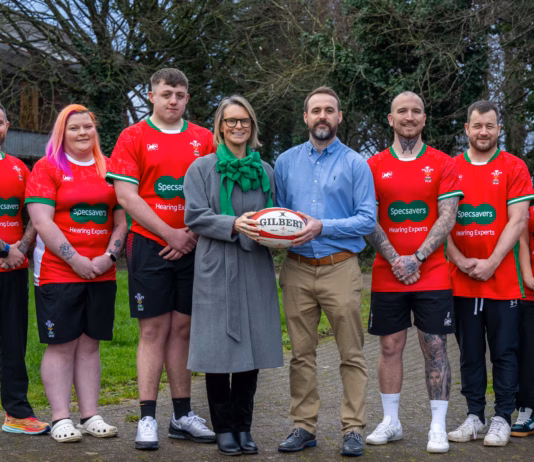 Specsavers calls on children to design Wales Deaf Rugby World Cup shirts Specsavers audiologist Kyle James centre right with Wales Deaf Rugby chair Siân Elin Melbourne c
